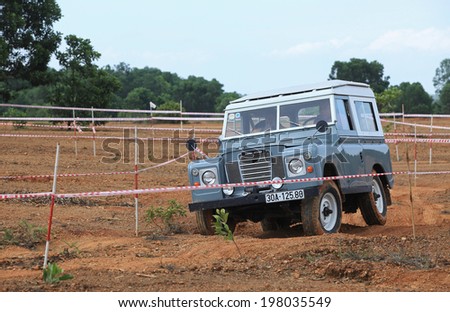 HANOI, VIETNAM - JUN 7, 2014: Unidentified Land Rover Defender running on off-road terrain of Vietnam Off-road Cup in a mountain area of Hanoi. This is an yearly event for off-road player in Vietnam.