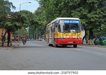 HANOI, VIETNAM - SEP 21, 2014: Unidentified bus running on a street of Hanoi capital. Traffic is one of the most serious problems of the country.
