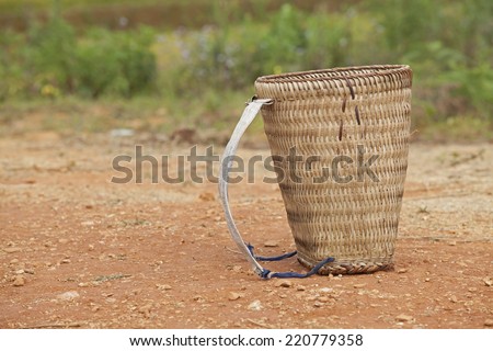 Bamboo bucket isolated on ground. This kind of container is used to carry rice in Vietnam.