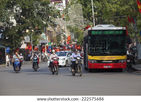 HANOI, VIETNAM - OCT 8, 2014: A bus running on a street in the center of Hanoi capital. Traffic is one of the most serious problems of the country.