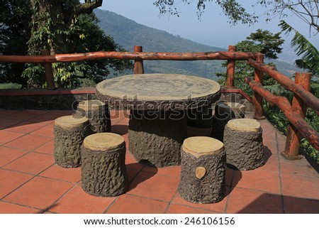 Dine table and chairs outdoor among an eco place