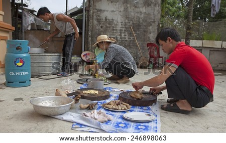 Hanoi, Vietnam - Jan 25, 2015: Asian people preparing a traditional meal on special occasion such as lunar (Chinese) new year.