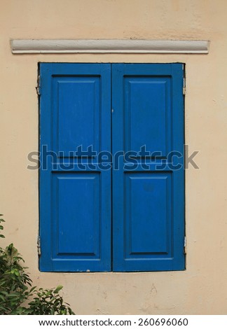Blue colored wooden window in a house in Hanoi, Vietnam
