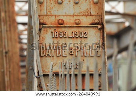 Hanoi, Vietnam - Mar 15, 2015: Name of bridge construction company (Dayde & Pille) who built Long Bien (within 3 years from 1899 to 1902) in time French ruled Vietnam.