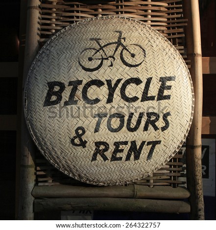 Close up of a sign for bicycle for rent or tours