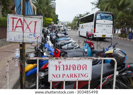 Pattaya, Thailand - Jul 17, 2015: Sign of service for tourist and visitor on the street side of Pattaya beach. Pattaya is a town on Thailandâ??s eastern Gulf coast known for a wild nightlife scene.