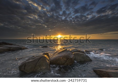 Sea  rock wave at sunset