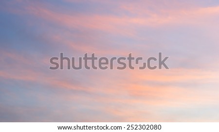 Blurred nature background clouds and smoke on the sky at sunset