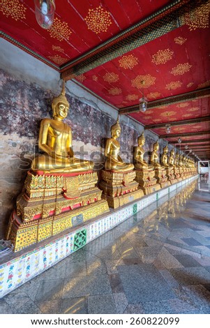 yellow buddha at Wat Suthat Thepwararam, Bangkok, Thailand: Historical and Public place