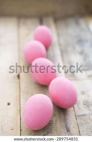 preserved egg on wood background