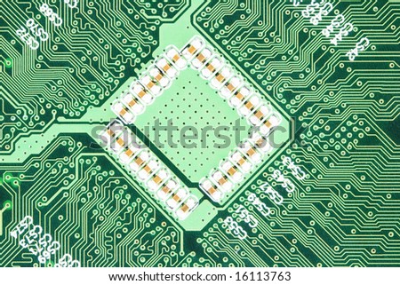 Am photo of the back side of green computer mother board.