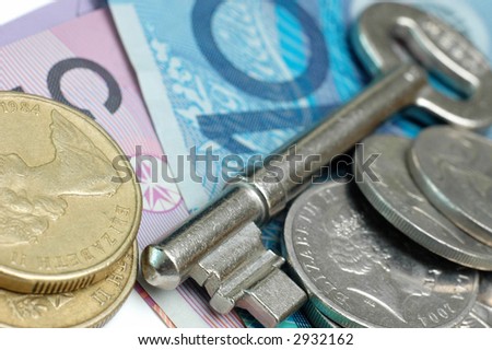 Key with Australia dollars and coins. Low DOF
