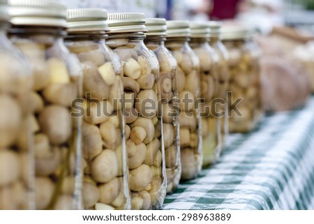Preserved Mushrooms in Mason Jars at Farmer\'s Market