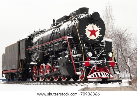old steam locomotive on a pedestal