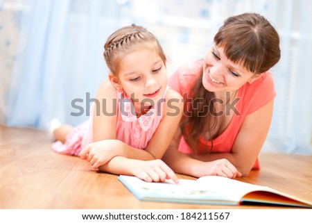 Daughter and mom read the book together.