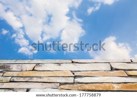 Old brown bricks walkway with blue sky in the background