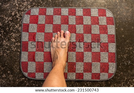 bare feet on doormat,dirty floor
