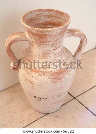 terracotta urn on tile floor