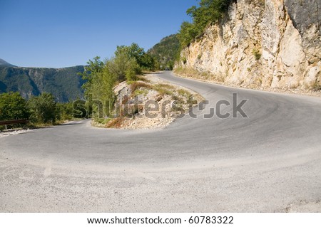 Sharp road curve in high mountains