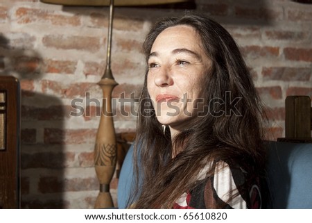 confident and friendly woman in a comfortable place