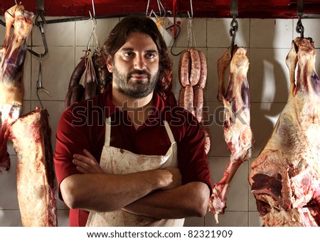 the butcher of the neighborhood in his shop