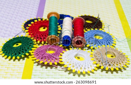 Spools of colored cotton thread used to sew