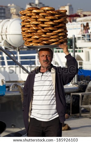 ISTANBUL, TURKEY - MAY 04: Unidentified man selling food that he carry on his head in Istanbul on May 04, 2013.