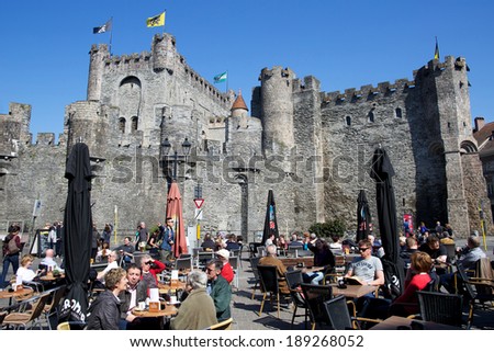 GHENT, BELGIUM - APRIL 21, 2014: Medieval old Ghent Castle with restaurant in front.