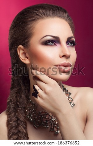 Portrait of beautiful woman and elegant hairstyle. Fashion photo