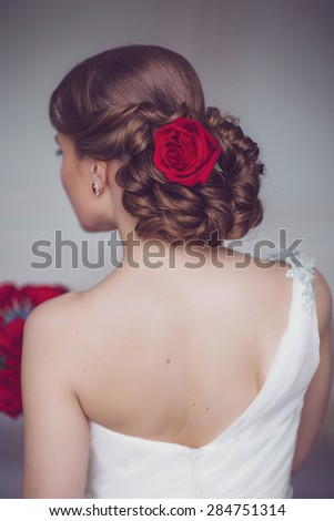 Coiffure of Young Beautiful Attractive Bride with Flowers. White Dress and Wedding Decorations. Vintage Toning