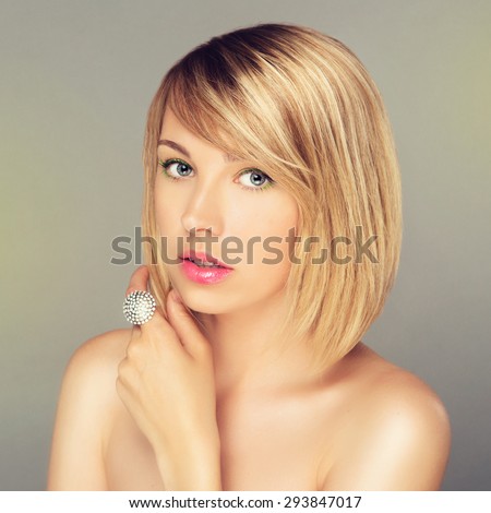 Portrait of Beautiful Blonde Woman with Blonde Hair and a Diamond Ring. Close Up