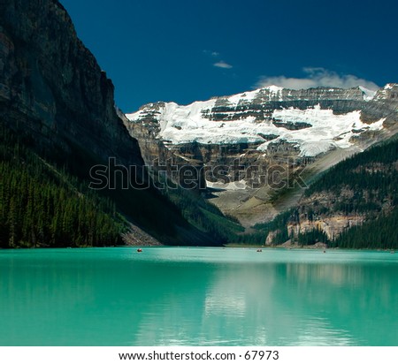 Lake Louise - this amazing big lake is located in the Banff National Park, Alberta, Canada. It\'s surrounded by high mountains with snow all year. It\'s also well known for the excellent ski resorts.