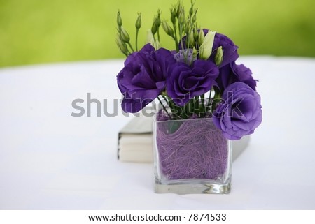 Flower decoration and book in a garden background