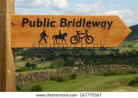 wooden public bridleway sign post