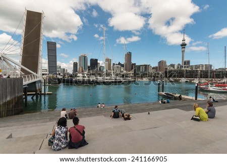 AUCKLAND, NEW ZEALAND - DECEMBER 6, 2014 - people watching opening of drawbridge in Auckland marina in New Zealand