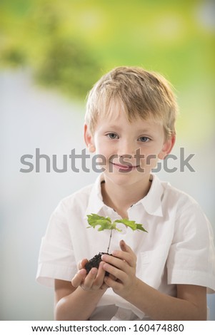 boy with small oak in his hands