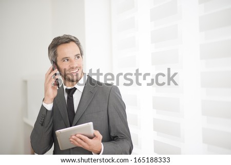 young businessman surfing on tablet