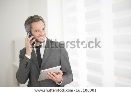 young businessman surfing on tablet
