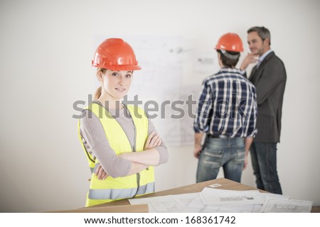 portrait of a female foreman during a meeting about a build project