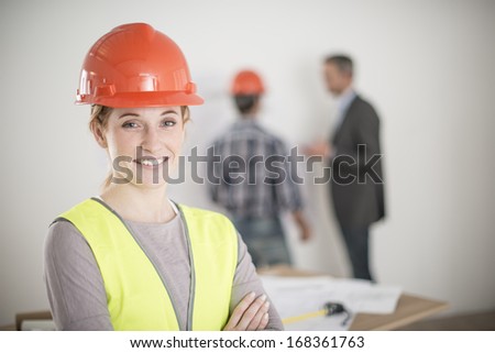 portrait of a female foreman during a meeting about a build project