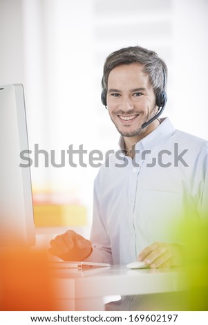 technical support operator working on computer