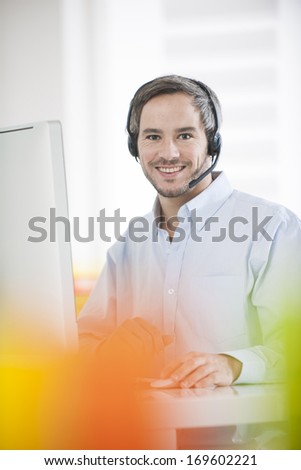 technical support operator working on computer