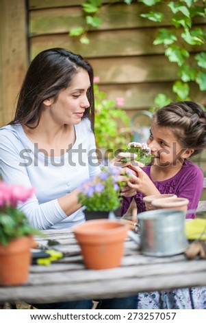 Mother daughter special moment. Gardening discovering and teaching
