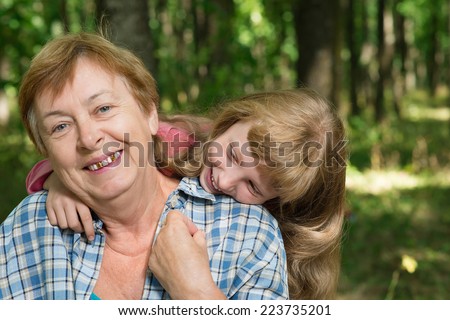 little girl hugging her grandmother