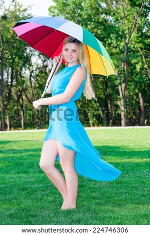 beautiful young woman with an umbrella rainbow