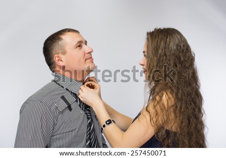 woman man tie a tie