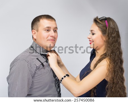 woman man tie a tie