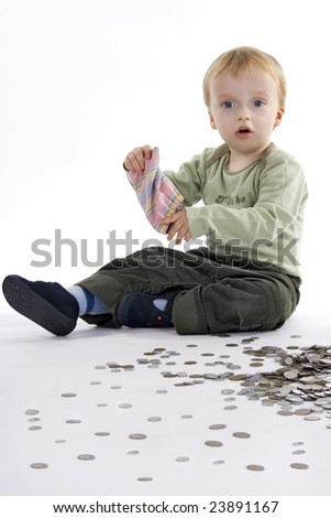 Boy scattered small change on egg white background