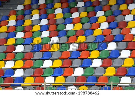 Colorful chairs in the stands at the stadium fans
