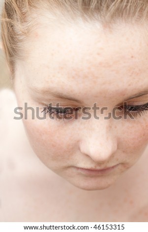 Close up of a cute young woman looking innocent